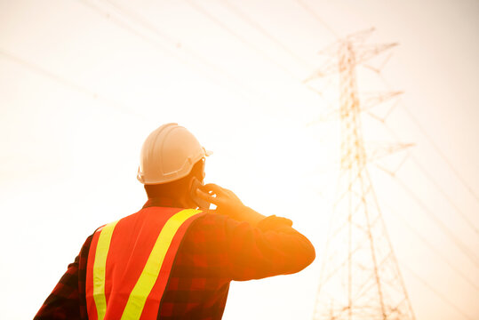 Engineers wear high telecommunication monitoring safety devices to maintain 5G networks, working with risky work.