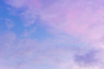 Obraz premium Sunset sky with floating clouds .beautiful cloud illuminated by the sun .concept background sky replacement .blue pink orange colors.