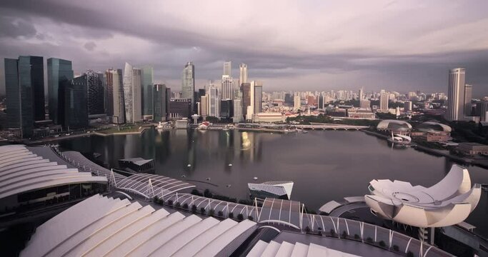 Timelapse of Singapore skyscrapers at day passing clouds shot in 4k uhd