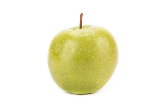 One whole green apple on white background, isolated