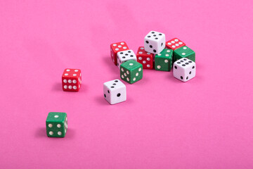 Multicolored Traditional dice on a colored background