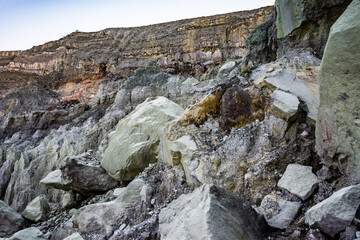 Rock wall and sulphur mining in Ijen crater in the morning in Kawah Ijen volcano Landmark from East Java Indonesia