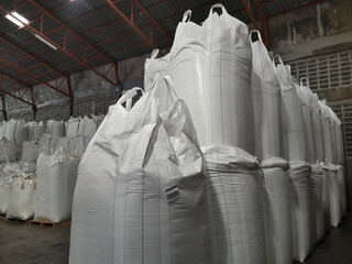 Chemical fertilizer Urea Stockpile white jumbo-bag Large  ammonia nitrate in waiting for shipment is placed in the warehouse. Transport for farmers 
