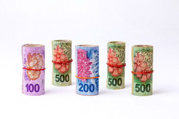 Five wads of Argentine money of rolled banknotes of 100, 200 and 500