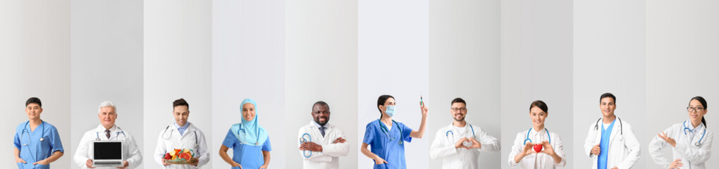 Group of doctors on grey background