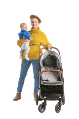 Woman with her cute baby and stroller on white background