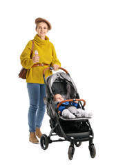 Woman and her cute baby in stroller on white background