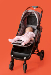 Cute little baby in stroller on color background