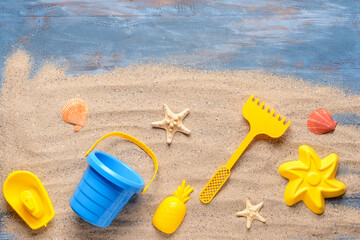 Fototapeta na wymiar Set of beach toys for children on color wooden background