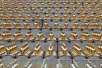 Million golden Buddha figurine in Wat Phra Dhammakaya. Buddhist temple, Bangkok, Thailand