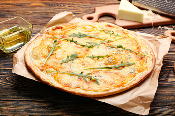 Tasty cheese pizza on wooden background