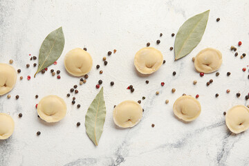 Raw dumplings on light background
