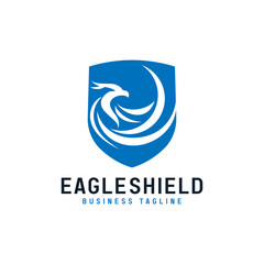 Blue Eagle Silhouette and Abstract Shield Emblem Combination Logo Design. Graphic Design Element