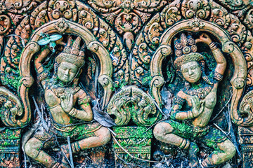 Fototapeta na wymiar Detail of sculpted stone in temple