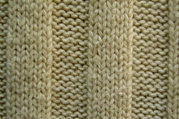 texture of knitted fabric close up. rough weaving