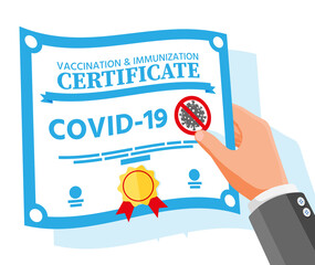 Covid-19 vaccination passport in hand.