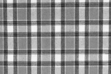 Black and white tartan texture background. shirt fabric with a checkered pattern. factory material