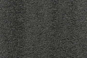 Black foam plastic background texture. black background for designers. dark styrofoam