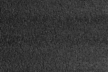 Black foam plastic background texture. black background for designers. dark styrofoam