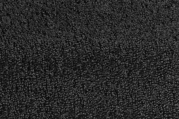 Black foam plastic background texture. black background for designers. dark styrofoam
