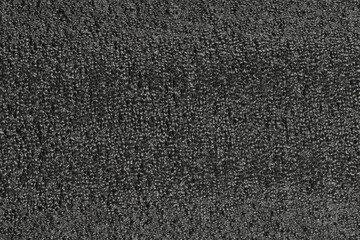 Black foam plastic background texture. black background for designers. dark styrofoam