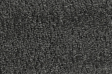 Black foam plastic background texture. black background for designers. dark styrofoam