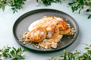 Curd pancakes with salted caramel, turkish yogurt and cashews
