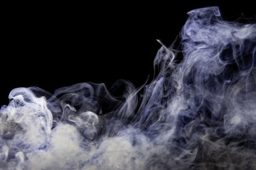 gray smoke with a blue tint on a black background