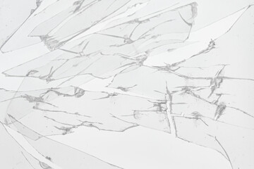 Broken pieces of glass on white background