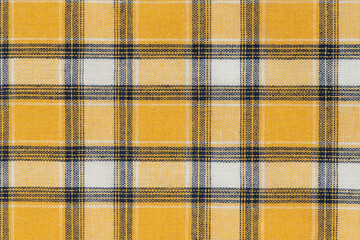 Yellow white tartan texture background. shirt fabric with a checkered pattern. factory material