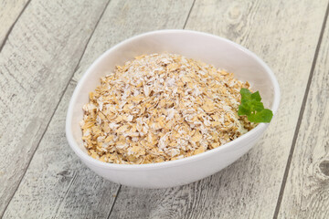 Raw oats in the bowl