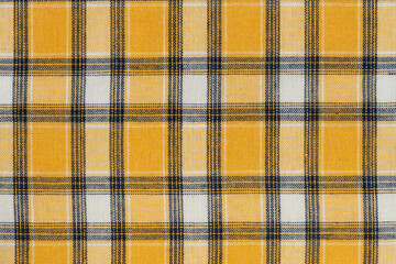 Yellow white tartan texture background. shirt fabric with a checkered pattern. factory material