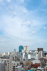 Fototapeta na wymiar Cityscape of Seoul, South Korea with houses and buildings. Copy space in the sky.
