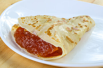 Delicous pancake with fruit jam
