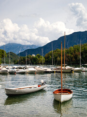 Fototapeta na wymiar Boats on the blue water of Lake Como