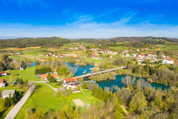 Beautiful countryside landscape, Mreznica river from air, aerial view of Belavici village in Croatia