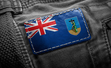 Tag on dark clothing in the form of the flag of the Montserrat