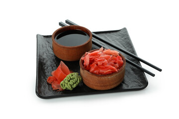 Fototapeta na wymiar Plate with pickled ginger, soy sauce, chopsticks and wasabi isolated on white background