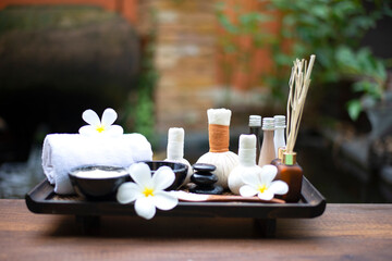 Spa Thai setting for aroma therapy and sugar and salt massage with flower on the bed, relax and healthy care. Healthy Concept