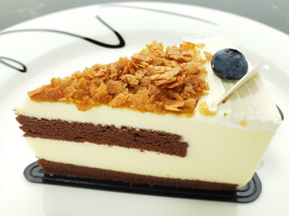 A piece of chocolate cake on a white plate, holiday dessert
