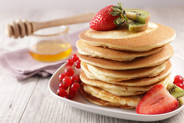 pile of pancakes and berries fruits