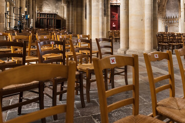 Fototapeta na wymiar A church with empty seats during coronavirus pandemic Covid-19.