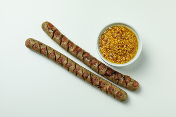Grilled sausage and sauce on white background
