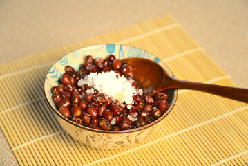 Spoon in a bowl full of red beans, close-up
