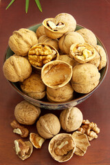 Close-up, a bowl full of peeled walnuts to boost brainpower nutrition, top view