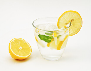 A glass of lemon juice. Lemon and mint, summer refreshing detox drink