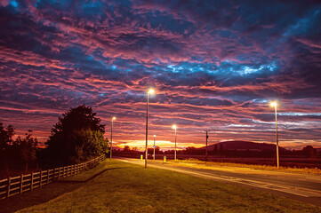 Undulating clouds over the road.