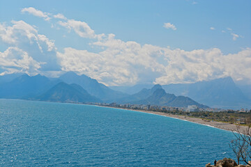 blue sky with clouds with mountains with sea 