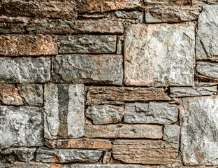 dark stone wall closeup, textured pattern, natural background