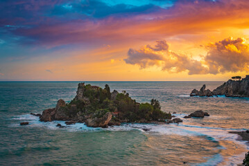 Magical sunset sky over Isola Bella in Taormina, Sicily 